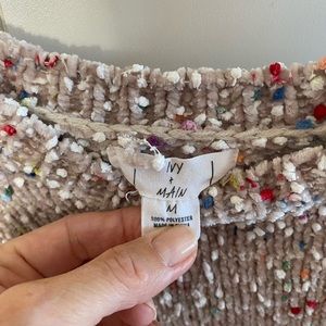 Women’s multi-colored cropped sweater. Falls to waist. Very very soft.